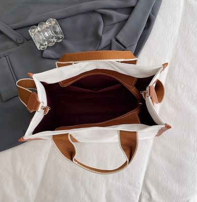 Materiale principale Borse da mano PU GHJ-31 per donne con rilevamento del movimento e disegno a strisce