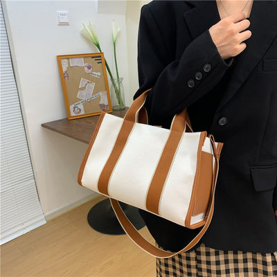 Materiale principale Borse da mano PU GHJ-31 per donne con rilevamento del movimento e disegno a strisce