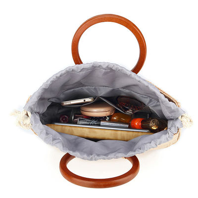 Borsa da donna tessuta con maniglia in legno e erba per il tempo libero con disegni di moda