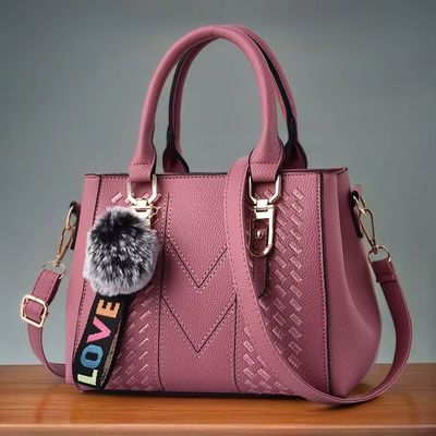 Elegante borsa da spalla in pelle vera con disegno di animazione e decorazione dei pulsanti