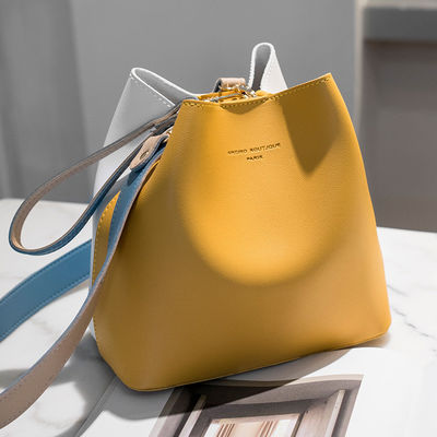 Borsa da secchio femminile estiva 2024 Contrasto colore e rilevamento del movimento per una borsa versatile